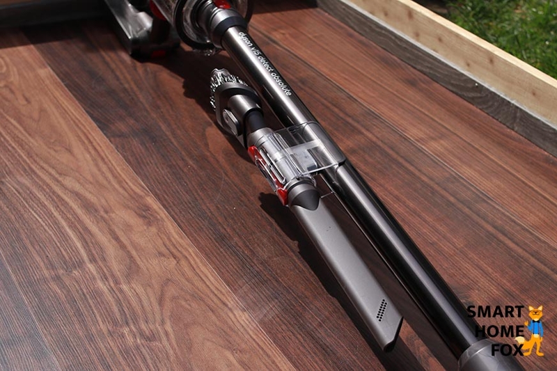 Vacuum wand accessory clip with accessories.